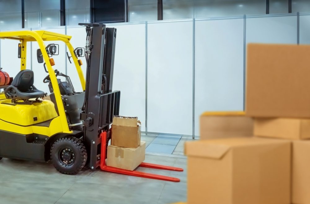 Forklift,Near,Cardboard,Boxes.,Storage,Equipment.,Forklift,For,Unloading,Goods.